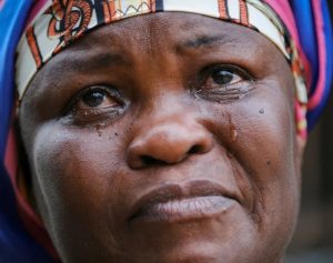 Janet Gyamfi, 52, a cocoa farmer, cries at her home as she recounts the destruction of her cocoa plantation by illegal gold mining activities. Only last year, the 27-hectare plot in western Ghana was covered with nearly 6,000 cocoa trees. Today, less than a dozen remain. "This farm was my only means of survival. I planned to pass it on to my children," she says. [Francis Kokoroko/Reuters]