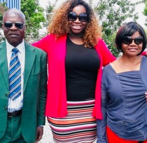 Dr. Antoinette Carole Grace Mbarga with her parents 