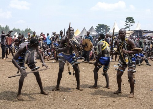 A mass circumcision advertised to tourists in rural Ugandan village. Some are angrily opposing