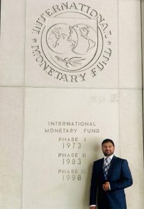 Ashraf Syed standingb before IMF Main Building