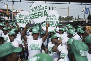 People dance to celebrate Democracy day on the streets of Lagos, Nigeria, Thursday, June 12, 2025 (AP Photo/Sunday Alamba)