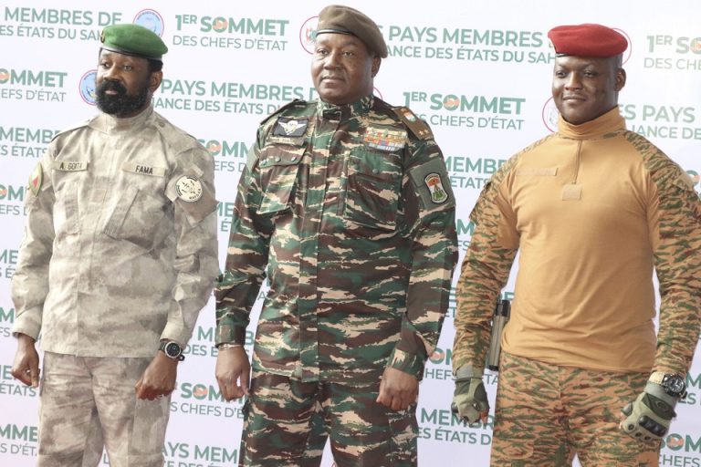 Heads of state of Mali's Assimi Goita, Niger's General Abdourahamane Tiani and Burkina Faso's Captain Ibrahim Traore pose for photographs during the first ordinary summit of heads of state and governments of the Alliance of Sahel States (AES) in Niamey,