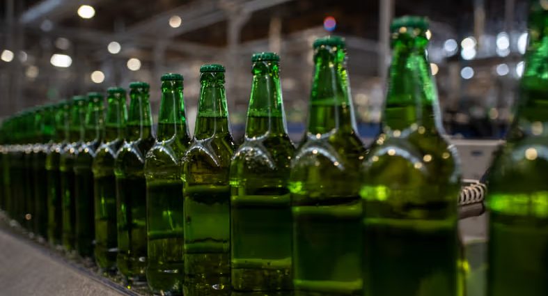 Bottles of beer on display as Nigeria’s leading brewers record over $1bn in combined revenue from beer and non alcoholic drinks within nine months of 2025. [Photo by STEFAN HEUNISAFP via Getty Images]
