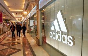 General view of the corridor at Global Harbor, with the Adidas store logo clearly visible on the glass façade. [Photo by Sheldon Cooper/SOPA Images/LightRocket via Getty Images]