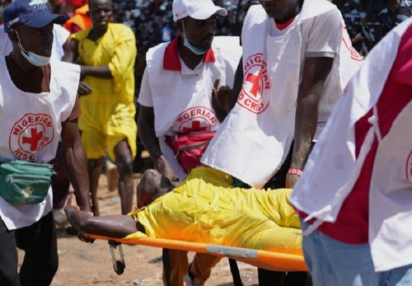 Red cross carry a man that collapsed after a pot swimming competition at the Argungu cultural fishing festival in Argungu, in Kebbi, northern Nigeria, Friday, Feb. 13, 2026. Sunday Alamba - AP