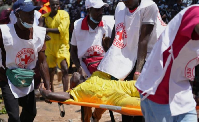 Red cross carry a man that collapsed after a pot swimming competition at the Argungu cultural fishing festival in Argungu, in Kebbi, northern Nigeria, Friday, Feb. 13, 2026. Sunday Alamba - AP