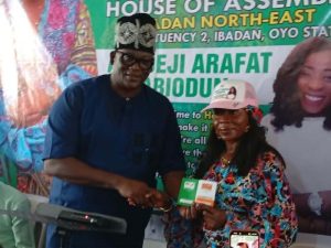 Presentation of membership card to Hon. Arafat