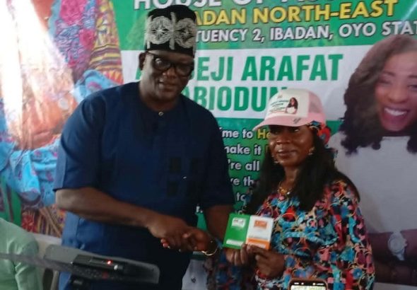 Presentation of membership card to Hon. Arafat