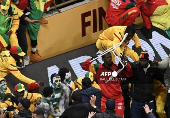 Senegal supporters clash during the Africa Cup of Nations (CAN) final football match between Senegal and Morocco at the Prince Moulay Abdellah Stadium in Rabat on January 18, 2026. (Photo by Paul ELLIS / AFP)