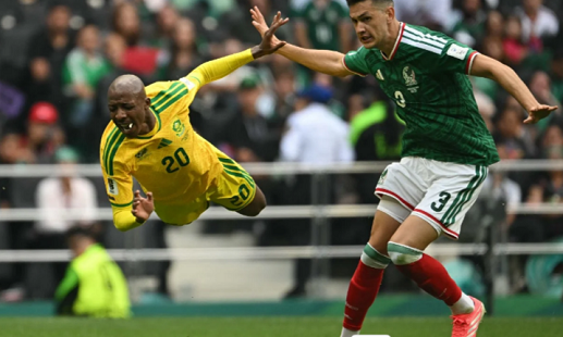 South Africa's defender #20 Khuliso Mudau is fouled by Mexico's defender #03 Cesar Montes during the 2026 World Cup Group A football match between Mexico and South Africa at the Mexico City Stadium in Mexico City on June 11, 2026. (Photo by Yuri CORTEZ / AFP)