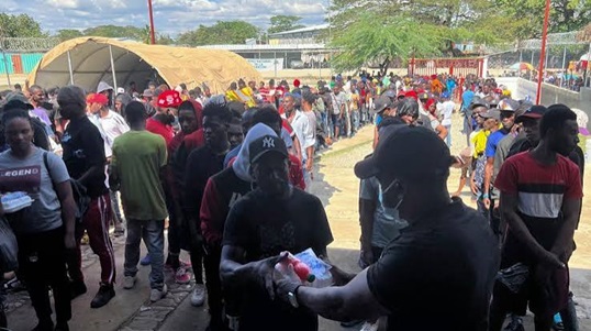U.S. deports dozens to Haiti as migrants visit new country